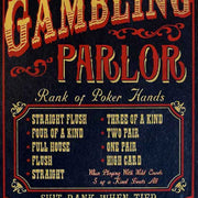 close up of rank of poker hands on wood sign