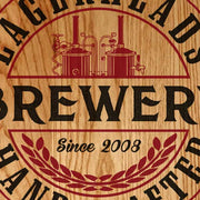 close up of text on round wood sign for Brewery