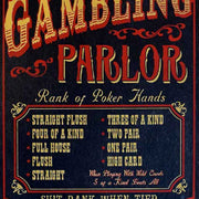 close up of rank of poker hands on wood sign