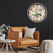 augusta golf clock on dark wall above a leather chair