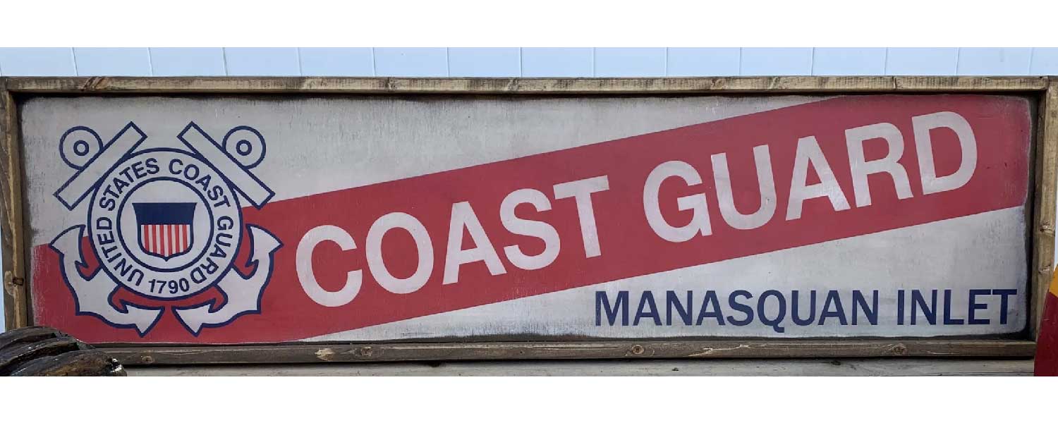 wood sign for US Coast Guard Station
