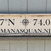 close up of vintage style wood sign with compass rose