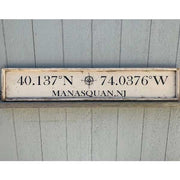 horizontal wood sign with lat and long of favorite city