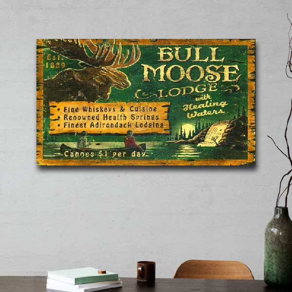 bull moose lodge rustic wood sign with image of a canoe and waterfall