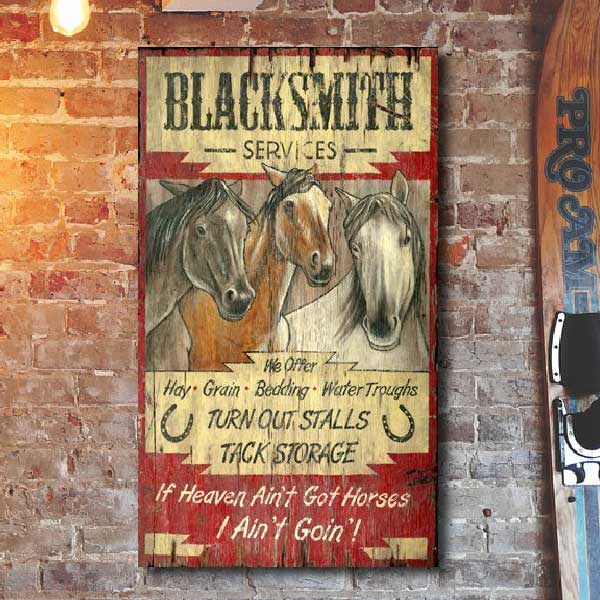 old west wood sign for Blacksmith services; image of horses
