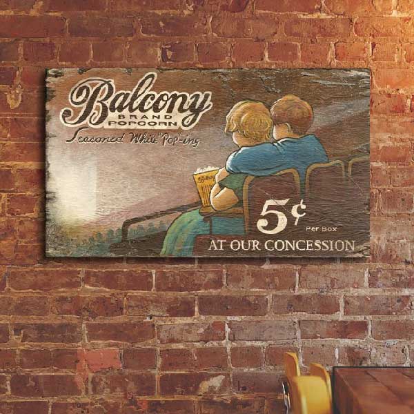 worn, rustic wood sign for Balcony theater popcorn