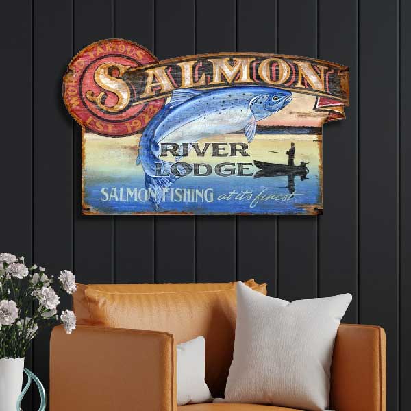Ad for Salmon River Lodge; Salmon Fishing at its Finest; drawing of Salmon and man fishing from a boat on a river