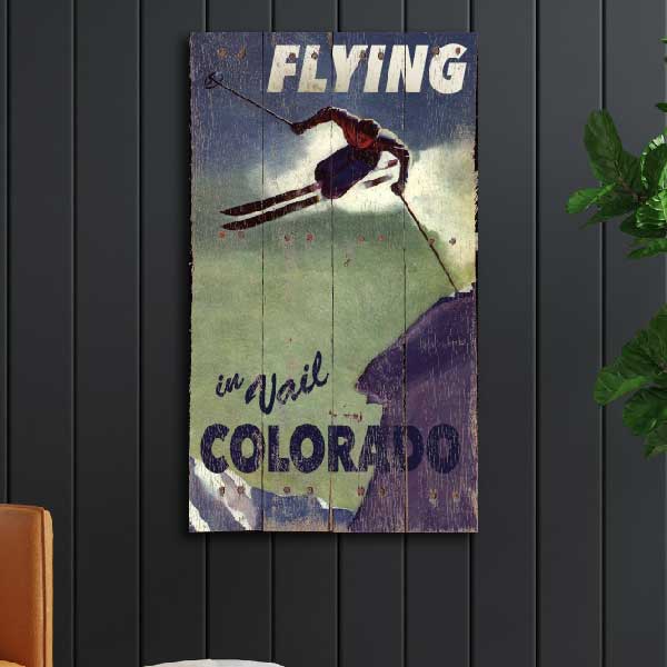 Flying in Vail old wood sign
