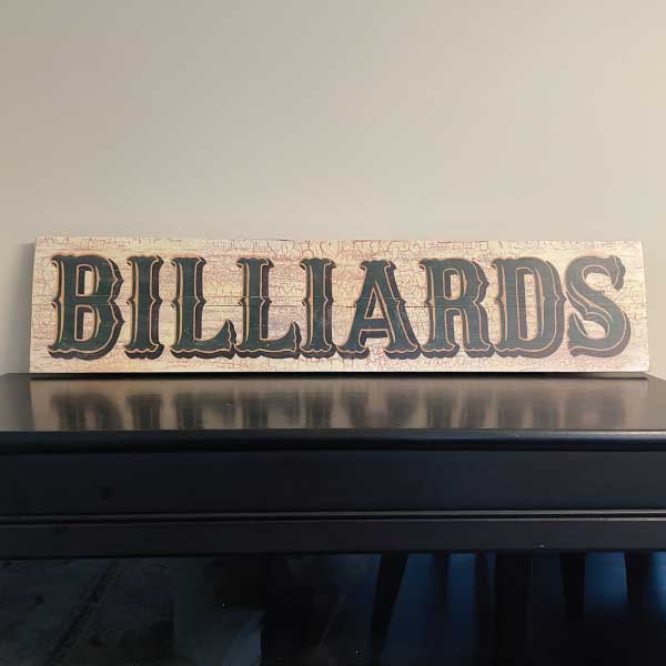 distressed wood sign: BILLIARDS; 7" x 32"