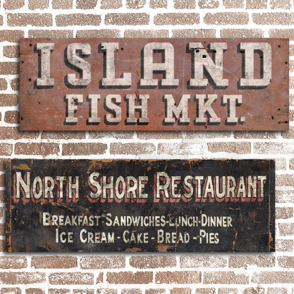 Restaurant and market signs on a brick wall