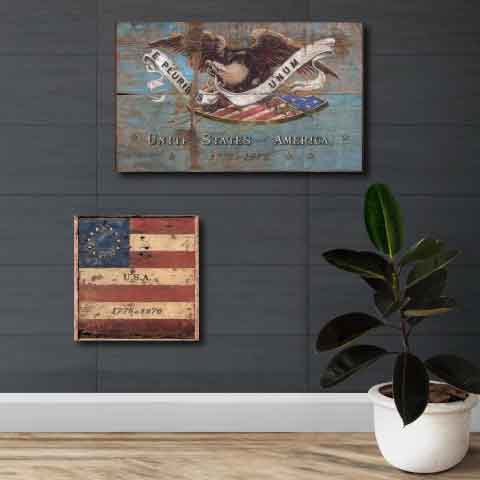 Two distressed Centennial US flags on gray wall