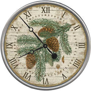 Mountain or forest themed wall clock with pine tree branches and pine cones.