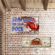 Distressed wood signs with Dungeness Crab