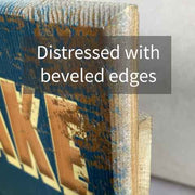 View of edge of sign showing beveled edges and distressed look of wood sign