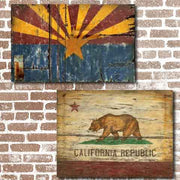 Distressed Arizona and California flags against brick wall; vintagewoodsigns.com