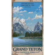 old wood sign with image of Grand Teton National Park