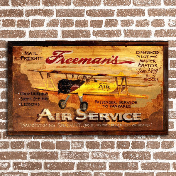 Old-school ad for Freeman's Air Service with biplane 