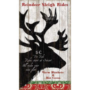 Reindeer head against a white wood background. Ad for Sleigh Rides for the holidays
