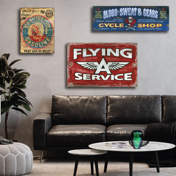 car services ad, vintage wood signs shown on a living room wall