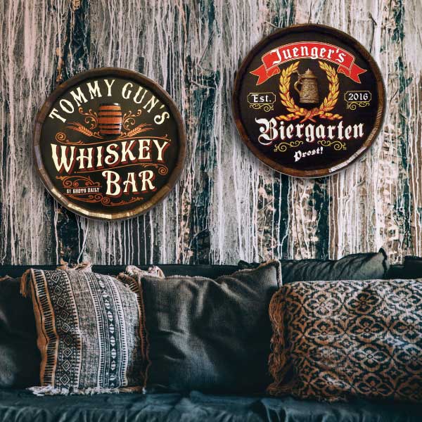 qtr barrel sign wall decor above couch on wood panel wall; beer garden and whiskey bar
