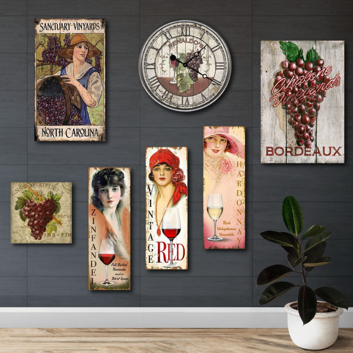 Winery wall with vintage wood signs depicting wine images